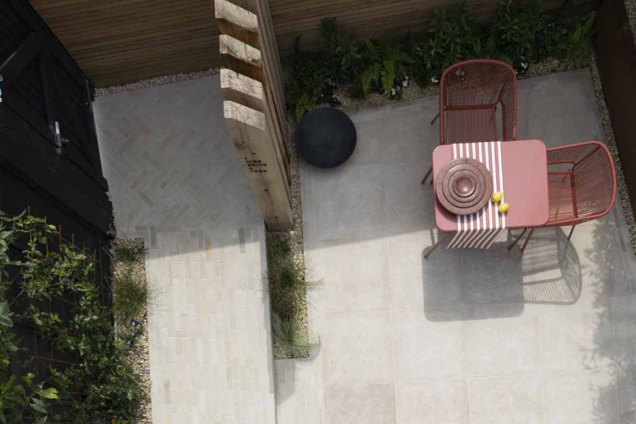 Birds eye view of garden design using beige sandstone pavers as pathway and eygptian limestone for patio.