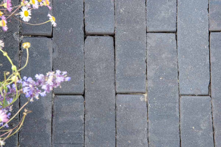 Close up view of charcoal grey clay pavers in the APL Trade Stand at RHS Tatton Park Flower Show 2024.