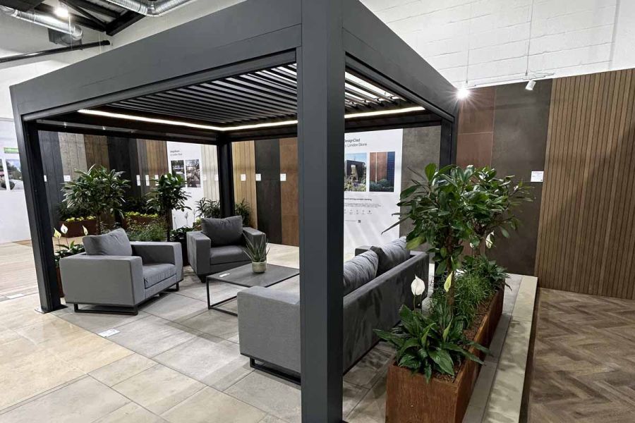 A sleek close-up of the vertical posts of the Deluxe Anthracite Grey Pergola, featured in a showroom, showing the modern design.