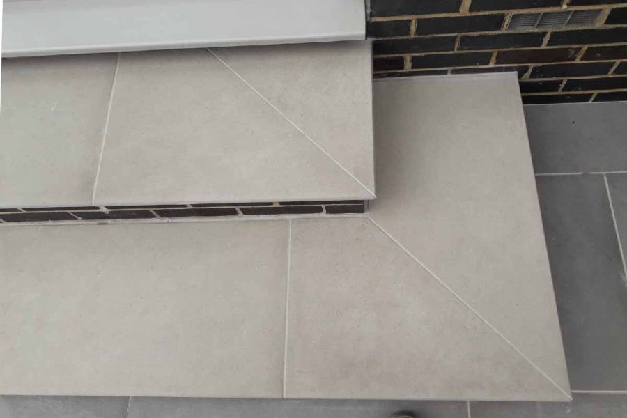 View of two corners of florence grey off the shelf steps with their moulded bullnose edges that matches the stones surface.