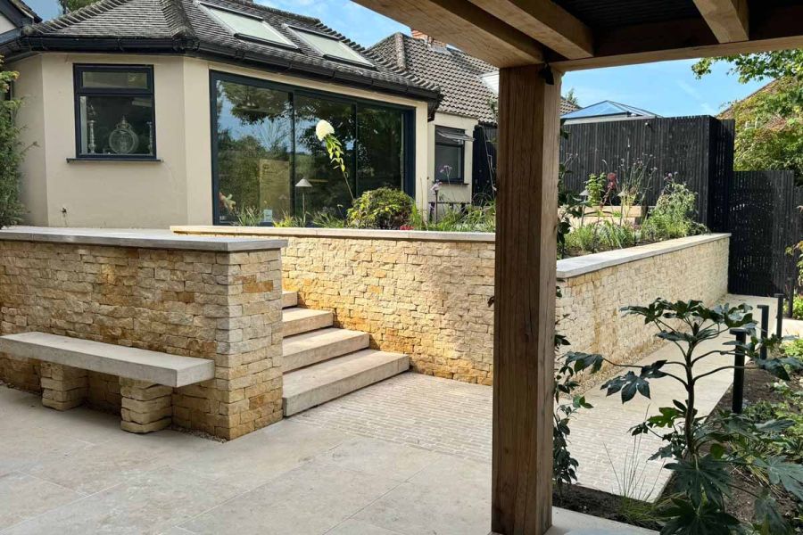 Patio of Jura Beige Porcelain leads to matching 40mm Downstand Step staircase that leads up to back of property.