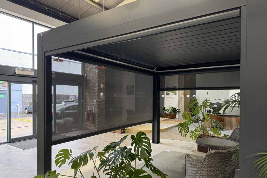 Close-up of frame and roof louvres on the Deluxe Pergola, demonstrating the quality of this metal pergola in a showroom setting.