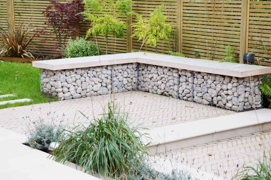 Two Stone Grey clay paver patios has  porcelain steps between with matching paving slabs in other paved area.