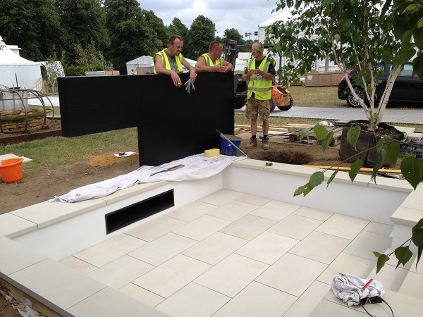 Beige sawn sandstone makes a smart contemporary sunken patio at RHS Hampton Court 2013.