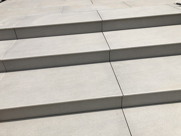 Close view down onto 4 Urban Grey 20mm bullnose steps. 