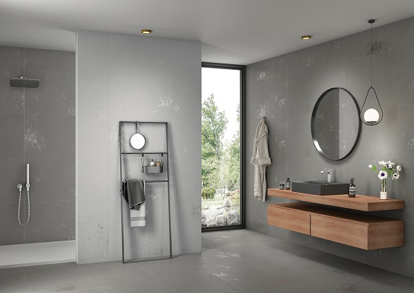 Bathroom with Valencia Grey porcelain tiles on floor and wall, with lighter tiles on adjacent wall.